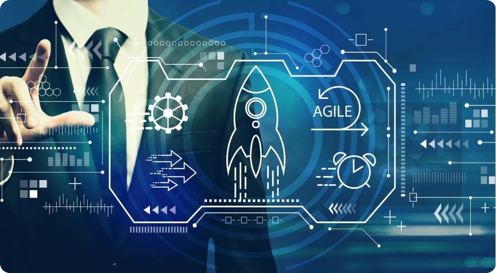 A business professional interacts with a blue and white digital interface that includes icons for a rocket taking off, gears, a clock, and the word AGILE, symbolizing the development and implementation of agile technology strategies.