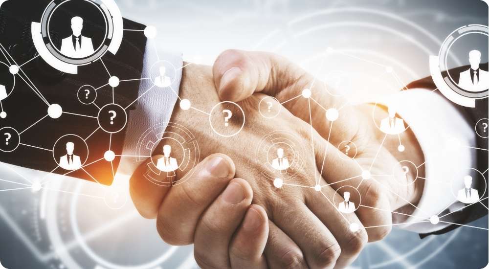 A close-up shot of two business people shaking hands, with a digital network graphic and icons of people and question marks overlaid, symbolizing future recruitment partnerships and technological collaboration.